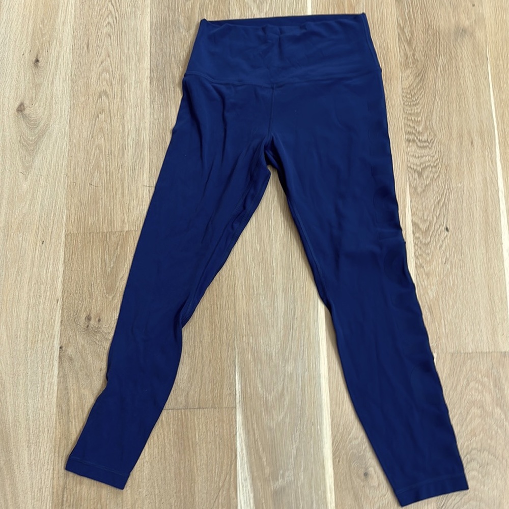 Lululemon leggings blue with imprinted “LULULEMON” on the side, size 8 no tag